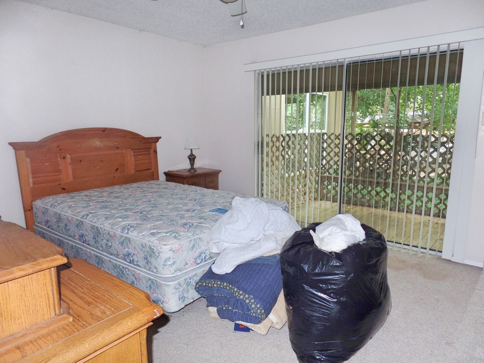 master bedroom with door to private deck