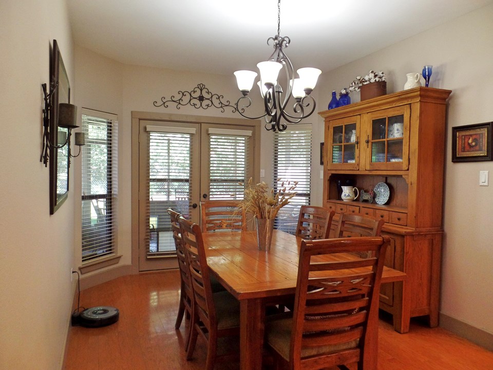 dining with french doors to screened porch