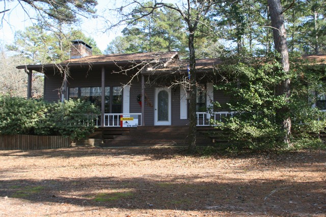 centrally located on 6 lots in the rolling piney woods.