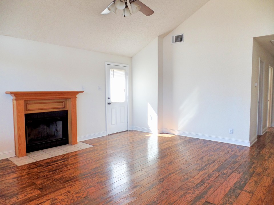 living room with wood burning fireplace