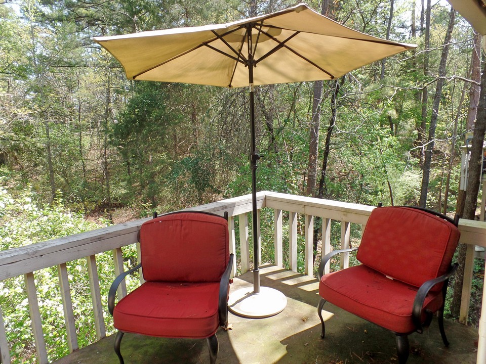 private balcony overlooking natural beauty of holly lake ranch
