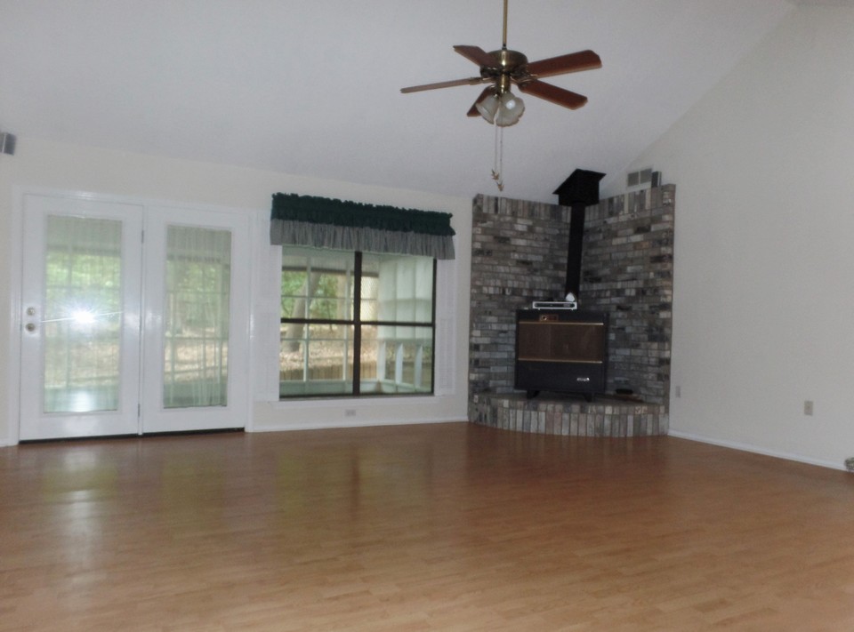 spacious living opens to large sunroom