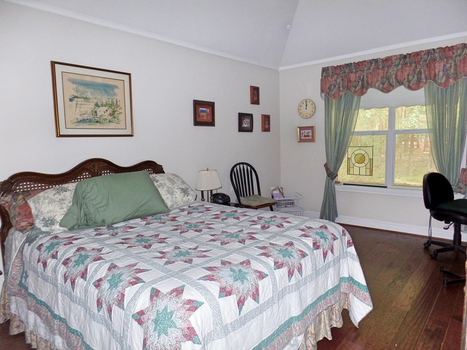 bedroom 2 with wood floor