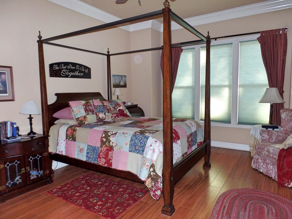spacious master bedroom with sitting area
