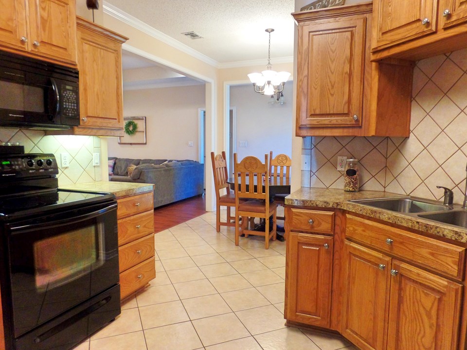 kitchen view to dining and living