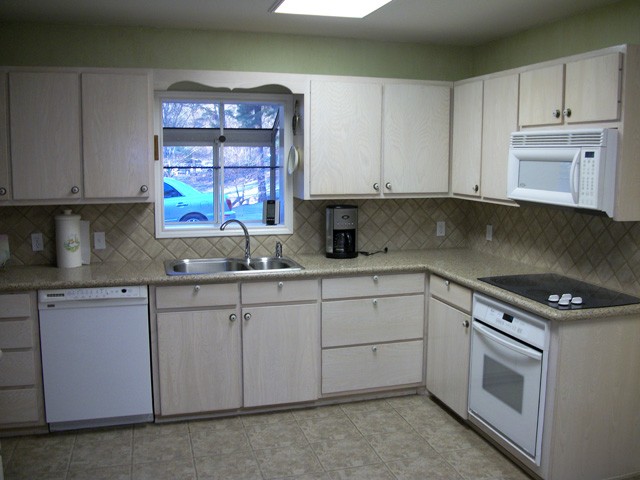 plenty of natural light into the kitchen through the shelf window above the sink.