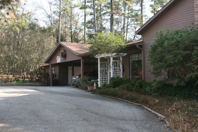 huge workshop to the left of the 2-car car port.