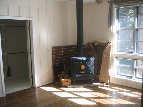 master sitting room with wood burning iron stove