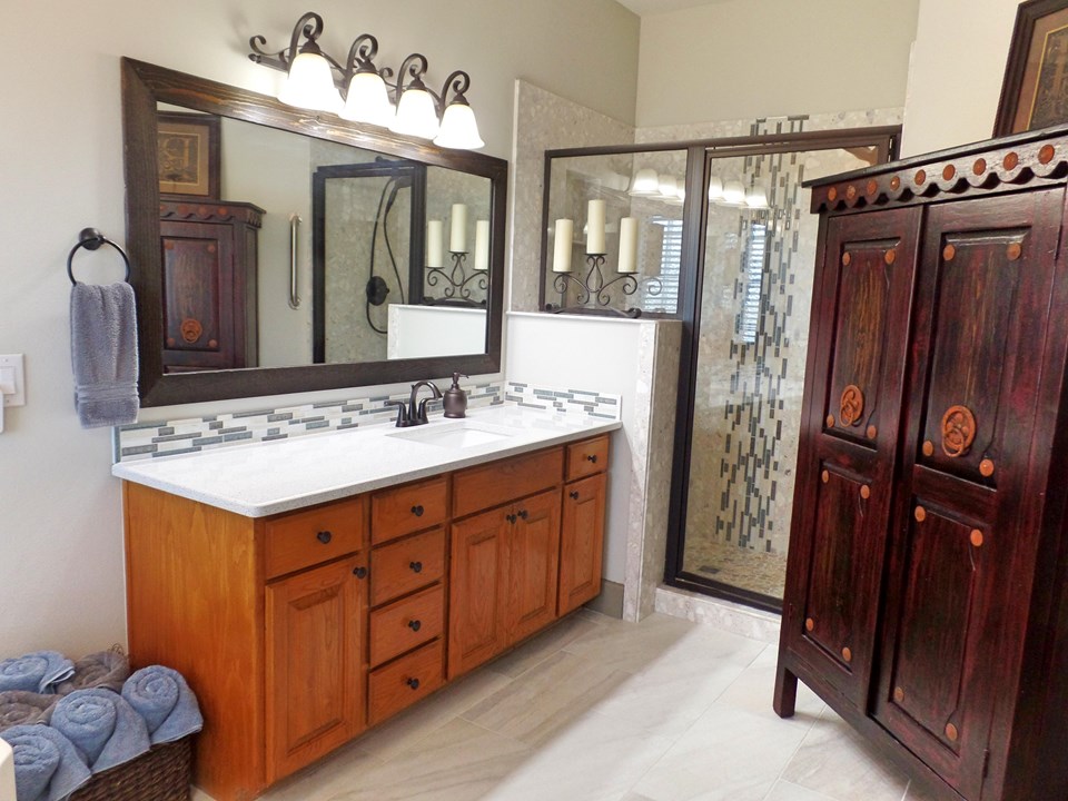 separate vanities and walk-in tile shower