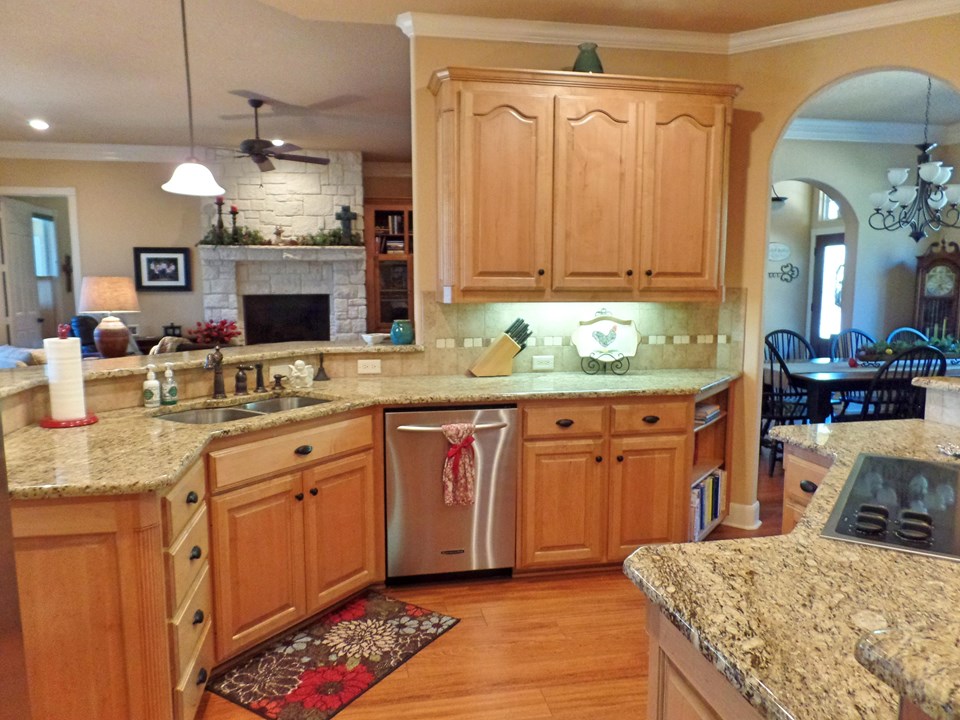 kitchen with granite and undercabinet lighting