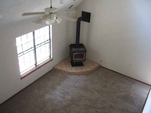 living room with iron fire place.