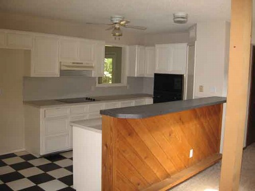 galley kitchen with breakfast bar.
